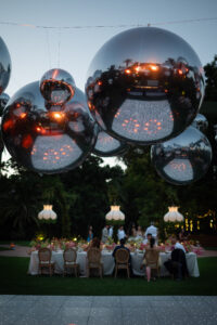 Disco balls and guests at an evening wedding celebration in Marbella