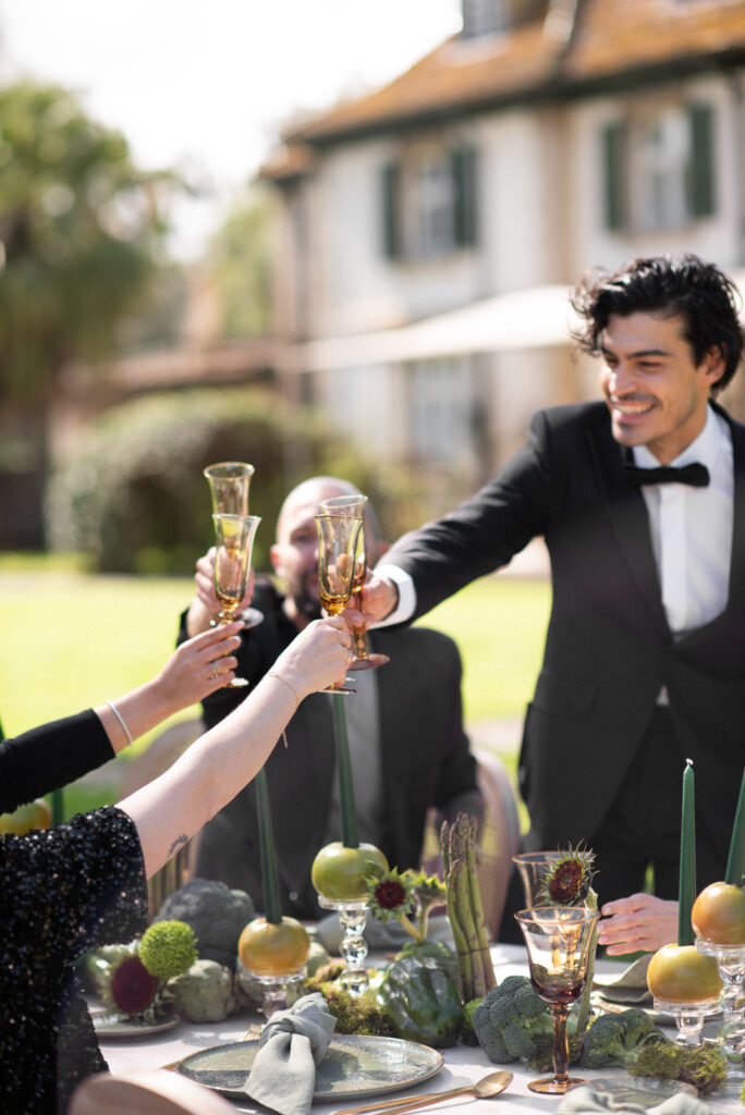 Groom enjoying a candid toast during his wedding celebration
