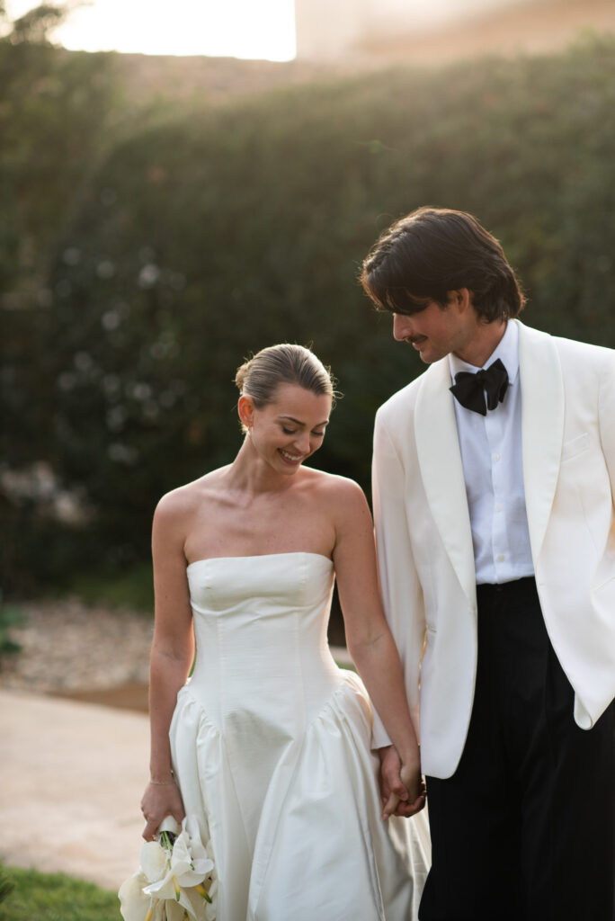 Newlyweds walking together at an elegant destination wedding in Mallorca
